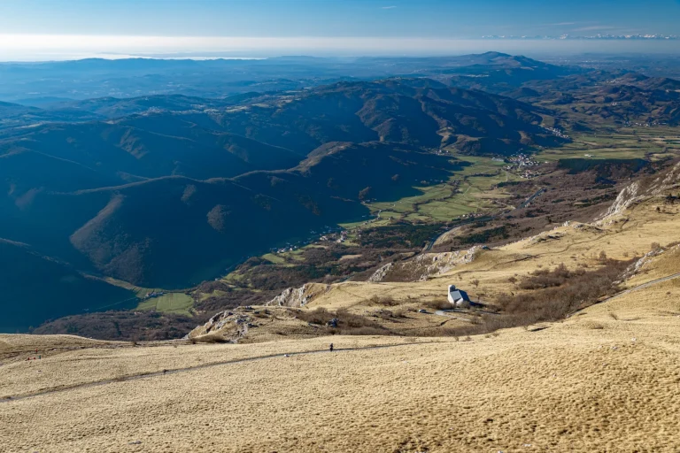 The view from the top of the Nanos mountain and Vipava valley with the stone church of st. Heronim, Slovenia